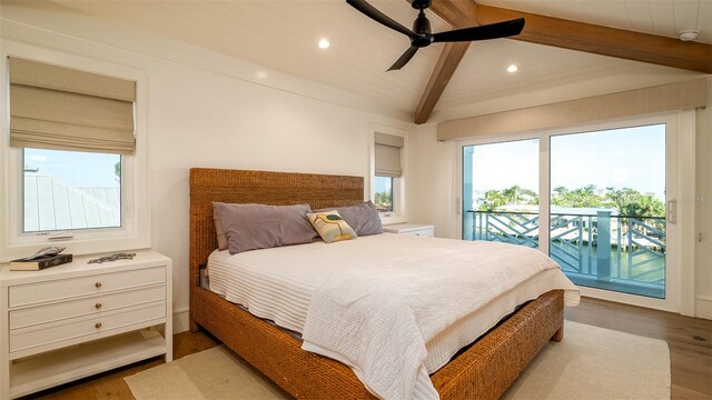 531 68th St, Holmes Beach, FL 34217 - bedroom with access to outside, beamed ceiling, multiple windows, recessed lighting, and wood finished floors