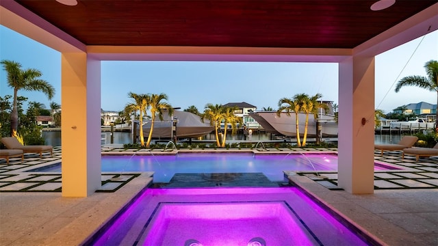 531 68th St, Holmes Beach, FL 34217 - view of pool with boat lift, a water view, a dock, and an in-ground hot tub