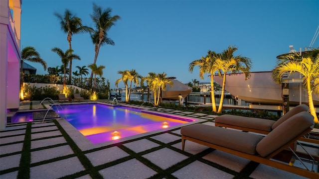 531 68th St, Holmes Beach, FL 34217 - swimming pool featuring boat lift, a patio area, and a boat dock