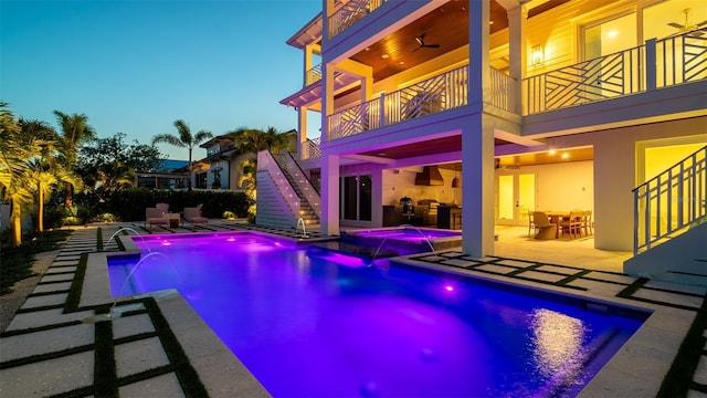 531 68th St, Holmes Beach, FL 34217 - view of pool featuring stairs, a patio, a pool with connected hot tub, and exterior kitchen