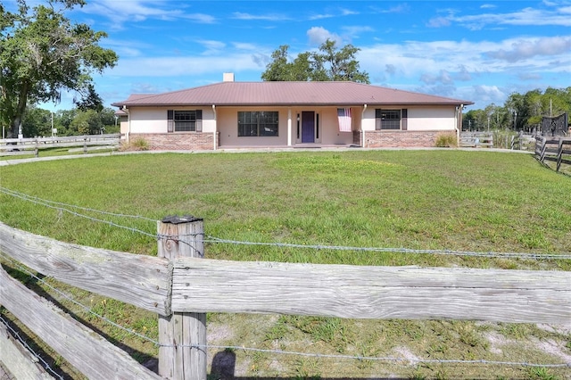 4404 Musket Dr, Lakeland, FL 33810 - ranch-style house featuring stucco siding, stone siding, and metal roof