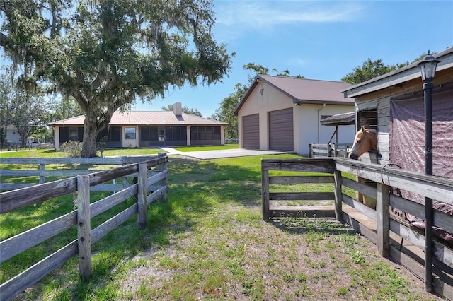 4404 Musket Dr, Lakeland, FL 33810 - view of yard with an outbuilding and a garage