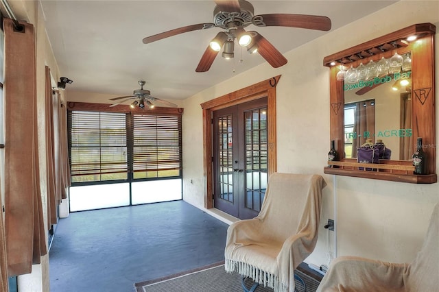 4404 Musket Dr, Lakeland, FL 33810 - living area featuring french doors, concrete flooring, and ceiling fan