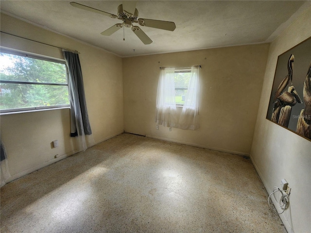220 Pinehurst Dr, Auburndale, FL 33823 - spare room with speckle patterned floor and a ceiling fan