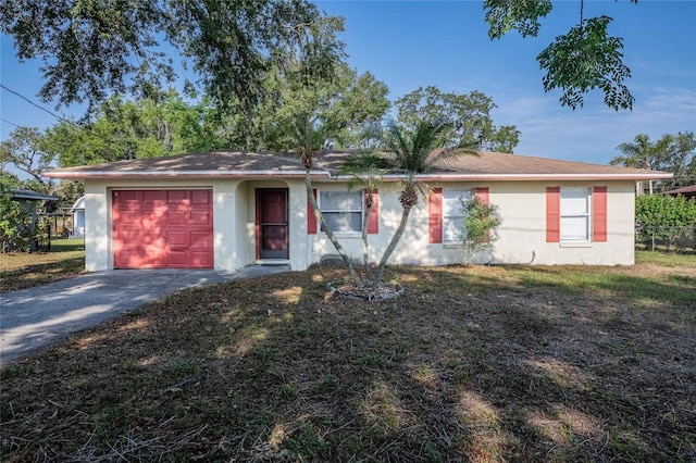 526 Marklen Loop, Polk City, FL 33868 - ranch-style house featuring stucco siding, driveway, and a garage