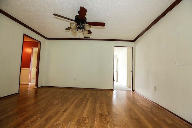 empty room featuring wood finished floors, ceiling fan, crown molding, and a textured ceiling