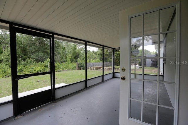 unfurnished sunroom featuring healthy amount of natural light
