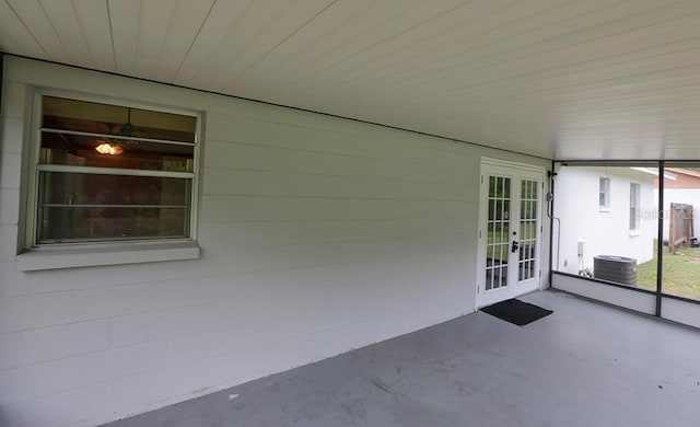 unfurnished sunroom featuring french doors