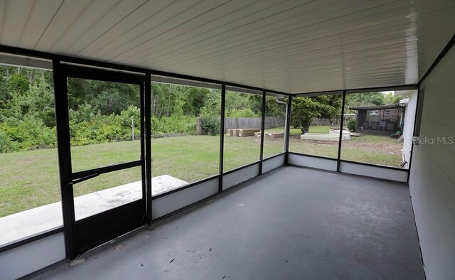 unfurnished sunroom featuring healthy amount of natural light
