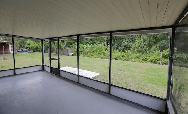 unfurnished sunroom featuring healthy amount of natural light