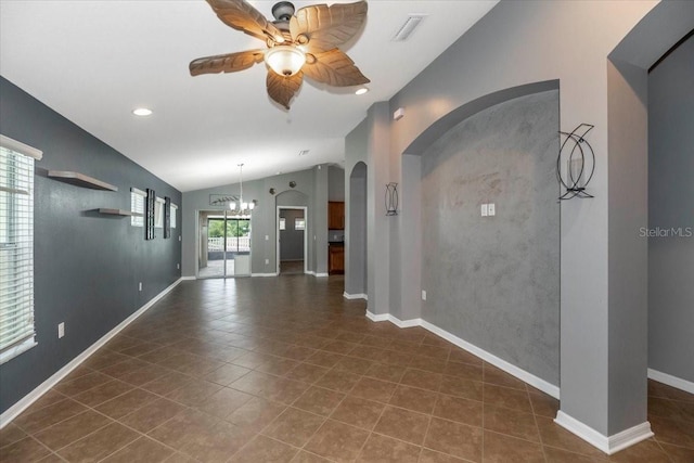 12654 Belcroft Dr, Riverview, FL 33579 - unfurnished living room with a ceiling fan, vaulted ceiling, a chandelier, arched walkways, and dark tile patterned floors