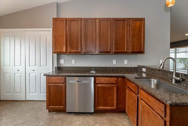 12654 Belcroft Dr, Riverview, FL 33579 - kitchen with dishwasher, a sink, light tile patterned flooring, dark stone counters, and lofted ceiling