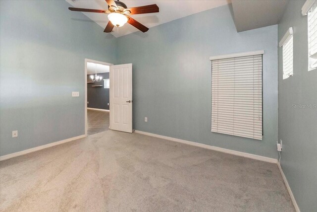 12654 Belcroft Dr, Riverview, FL 33579 - unfurnished room featuring carpet floors, a ceiling fan, baseboards, and vaulted ceiling