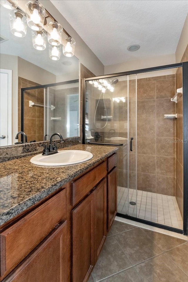 12654 Belcroft Dr, Riverview, FL 33579 - bathroom with tile patterned floors, a shower stall, and vanity
