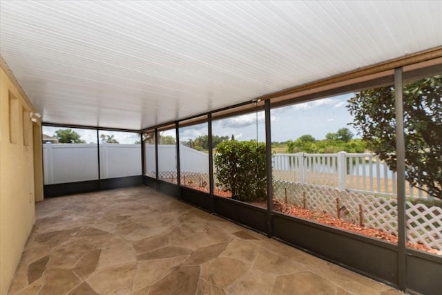 12654 Belcroft Dr, Riverview, FL 33579 - unfurnished sunroom with stone finish floors