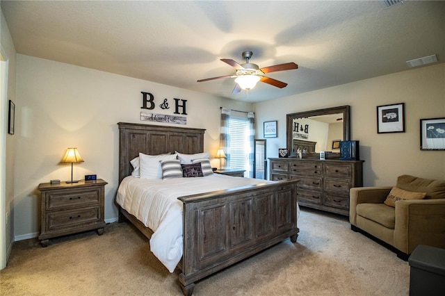 bedroom with light colored carpet and ceiling fan