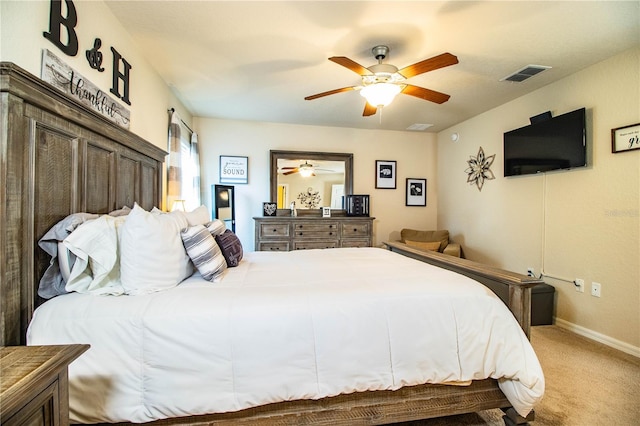 carpeted bedroom featuring baseboards and ceiling fan