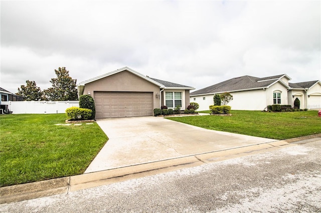 ranch-style house featuring stucco siding, a garage, and concrete driveway