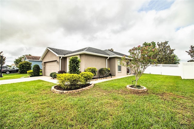 view of front of house featuring an attached garage, stucco siding, and driveway