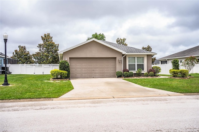 view of front of property featuring a garage, driveway, and stucco siding