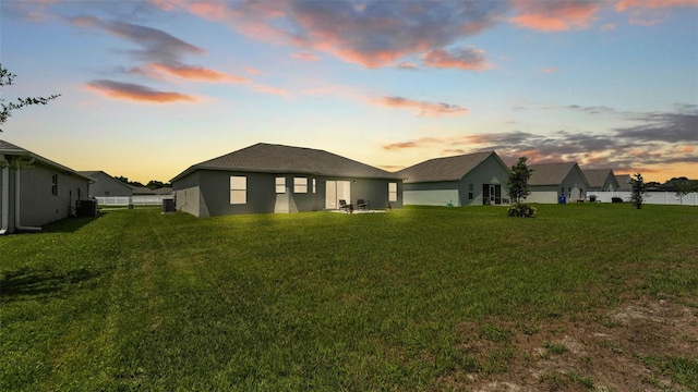 4582 Penkert Pl, Lakeland, FL 33811 - back of house with a lawn and stucco siding
