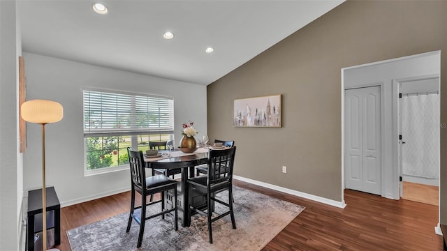 4582 Penkert Pl, Lakeland, FL 33811 - dining space featuring baseboards, dark wood-style flooring, recessed lighting, and high vaulted ceiling