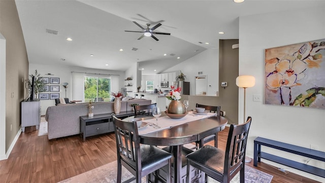4582 Penkert Pl, Lakeland, FL 33811 - dining area featuring wood finished floors, ceiling fan, vaulted ceiling, recessed lighting, and baseboards