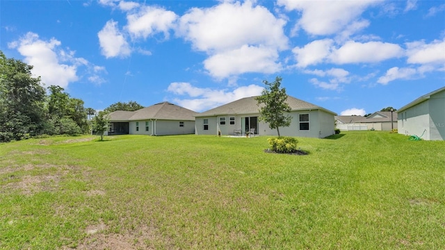 4582 Penkert Pl, Lakeland, FL 33811 - back of property featuring a yard
