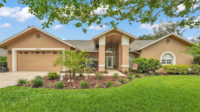 2912 Aston Ave, Plant City, FL 33566 - single story home featuring stucco siding, driveway, a front lawn, and a garage