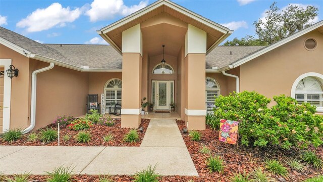 2912 Aston Ave, Plant City, FL 33566 - doorway to property with stucco siding and roof with shingles
