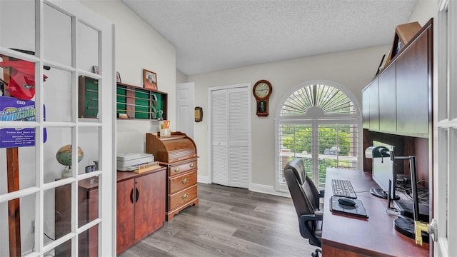 2912 Aston Ave, Plant City, FL 33566 - office space with wood finished floors, a textured ceiling, and baseboards