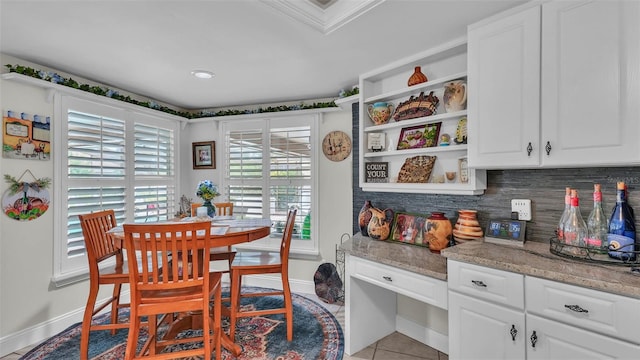 2912 Aston Ave, Plant City, FL 33566 - dining area with baseboards and light tile patterned floors