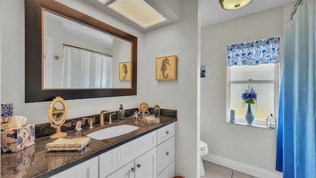 2912 Aston Ave, Plant City, FL 33566 - full bathroom with toilet, vanity, tile patterned floors, and baseboards