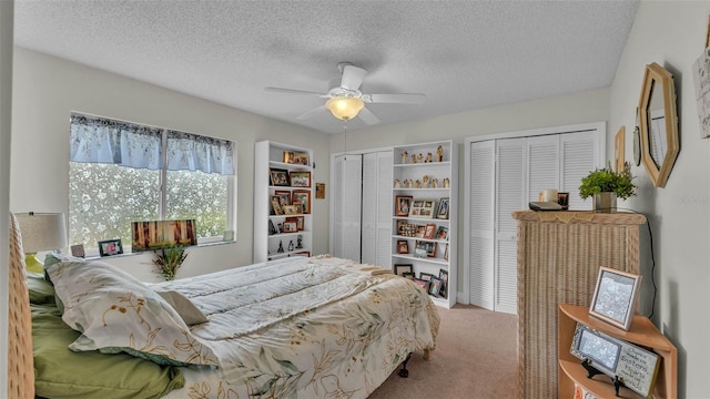 2912 Aston Ave, Plant City, FL 33566 - bedroom featuring carpet floors, two closets, a textured ceiling, and ceiling fan