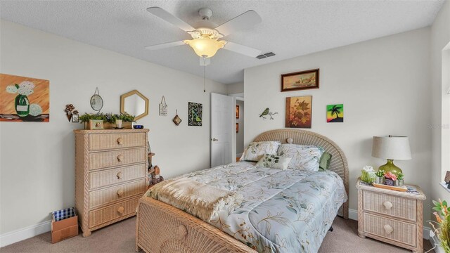 2912 Aston Ave, Plant City, FL 33566 - carpeted bedroom featuring baseboards, ceiling fan, and a textured ceiling