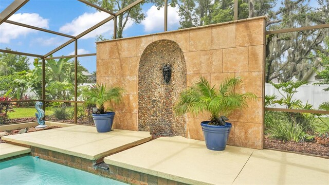 2912 Aston Ave, Plant City, FL 33566 - view of patio with a lanai, an outdoor pool, and fence