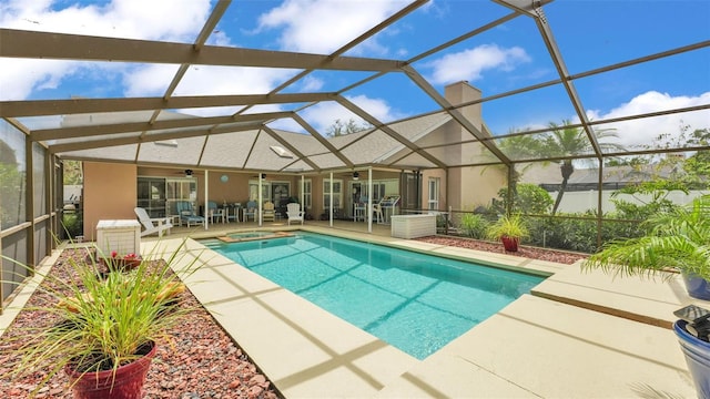 2912 Aston Ave, Plant City, FL 33566 - view of pool featuring a ceiling fan, a patio, a pool with connected hot tub, and glass enclosure