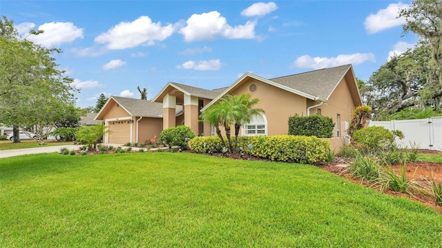 2912 Aston Ave, Plant City, FL 33566 - view of front facade featuring stucco siding, an attached garage, and concrete driveway