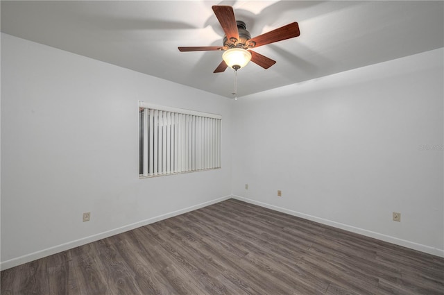 409 San Jose Dr, Winter Haven, FL 33884 - empty room with dark wood-style floors, a ceiling fan, and baseboards