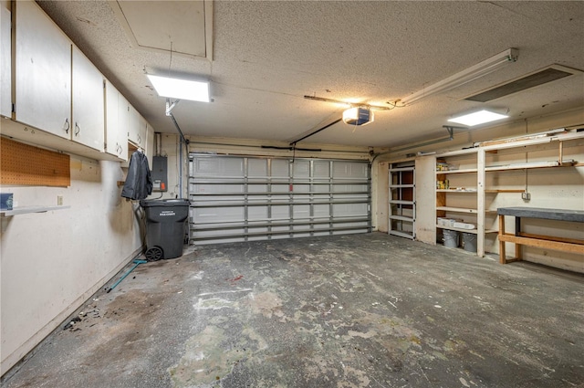 409 San Jose Dr, Winter Haven, FL 33884 - garage featuring a garage door opener and electric panel