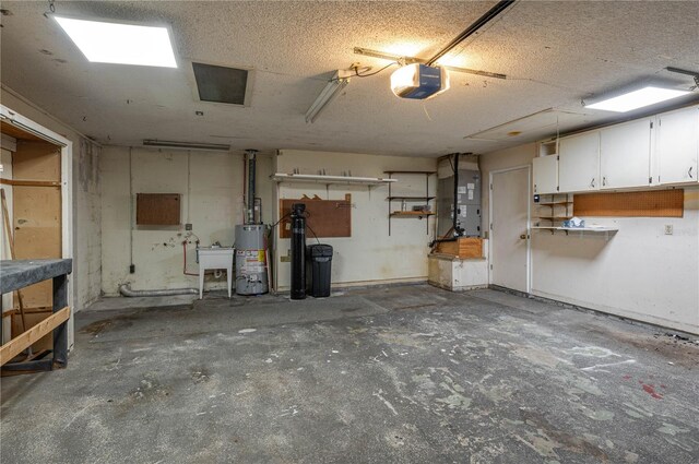 409 San Jose Dr, Winter Haven, FL 33884 - below grade area with water heater, heating unit, a garage, a textured ceiling, and a water softener system