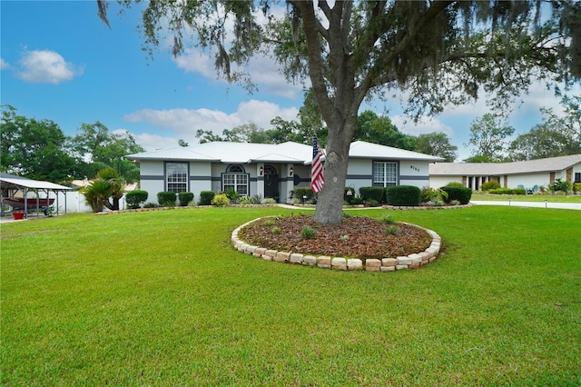 8760 Plantation Ridge Blvd, Lakeland, FL 33809 - ranch-style house with a front yard, stucco siding, and an attached garage