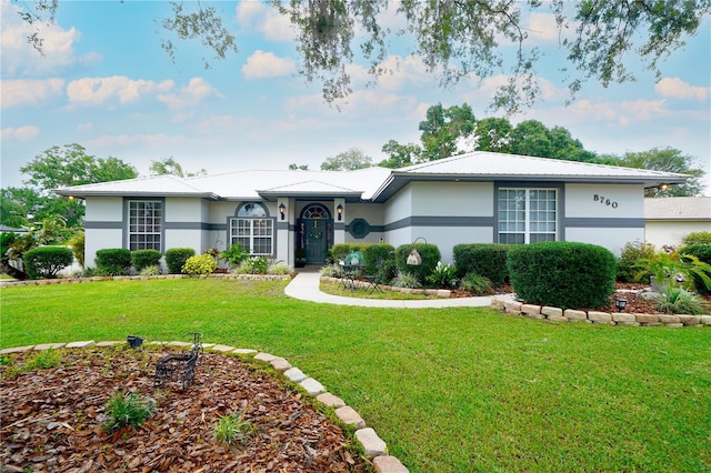 8760 Plantation Ridge Blvd, Lakeland, FL 33809 - ranch-style house with stucco siding and a front yard