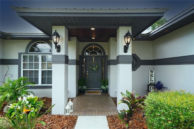 8760 Plantation Ridge Blvd, Lakeland, FL 33809 - doorway to property featuring stucco siding