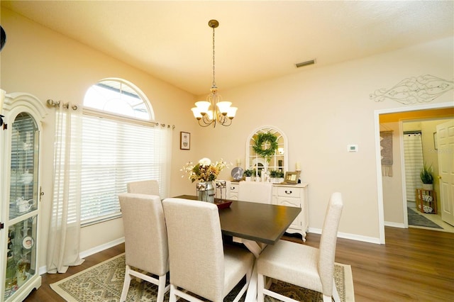 8760 Plantation Ridge Blvd, Lakeland, FL 33809 - dining area with dark wood-type flooring, plenty of natural light, and a chandelier