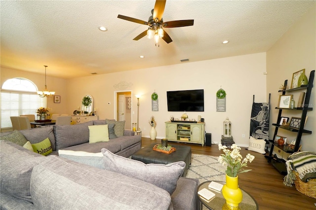 8760 Plantation Ridge Blvd, Lakeland, FL 33809 - living room featuring ceiling fan, wood finished floors, a chandelier, a textured ceiling, and baseboards