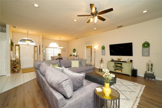 8760 Plantation Ridge Blvd, Lakeland, FL 33809 - living room featuring a textured ceiling, a ceiling fan, wood finished floors, recessed lighting, and baseboards