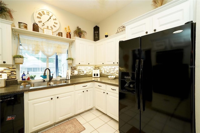 8760 Plantation Ridge Blvd, Lakeland, FL 33809 - kitchen with black appliances, a sink, tasteful backsplash, and dark countertops