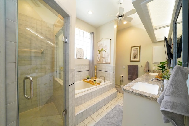 8760 Plantation Ridge Blvd, Lakeland, FL 33809 - bathroom featuring vanity, a bath, tile patterned flooring, ceiling fan, and a shower stall