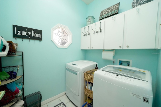 8760 Plantation Ridge Blvd, Lakeland, FL 33809 - washroom with cabinet space, separate washer and dryer, light tile patterned floors, and baseboards